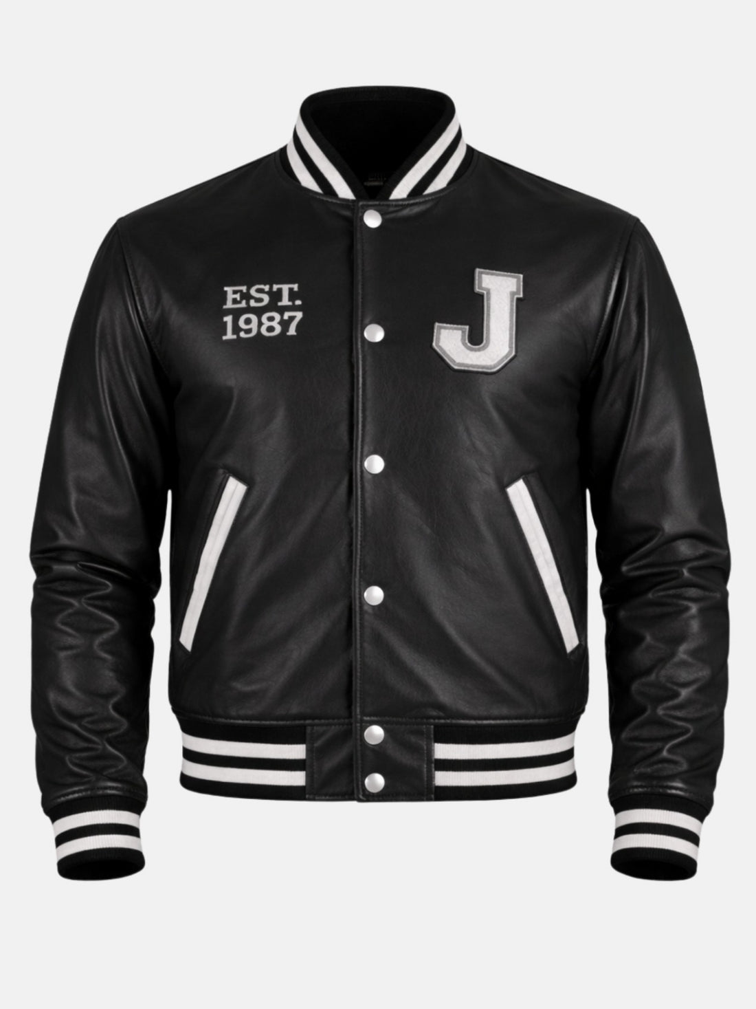 Man wearing black leather letterman jacket with white J patch and Est 1987 embroidery