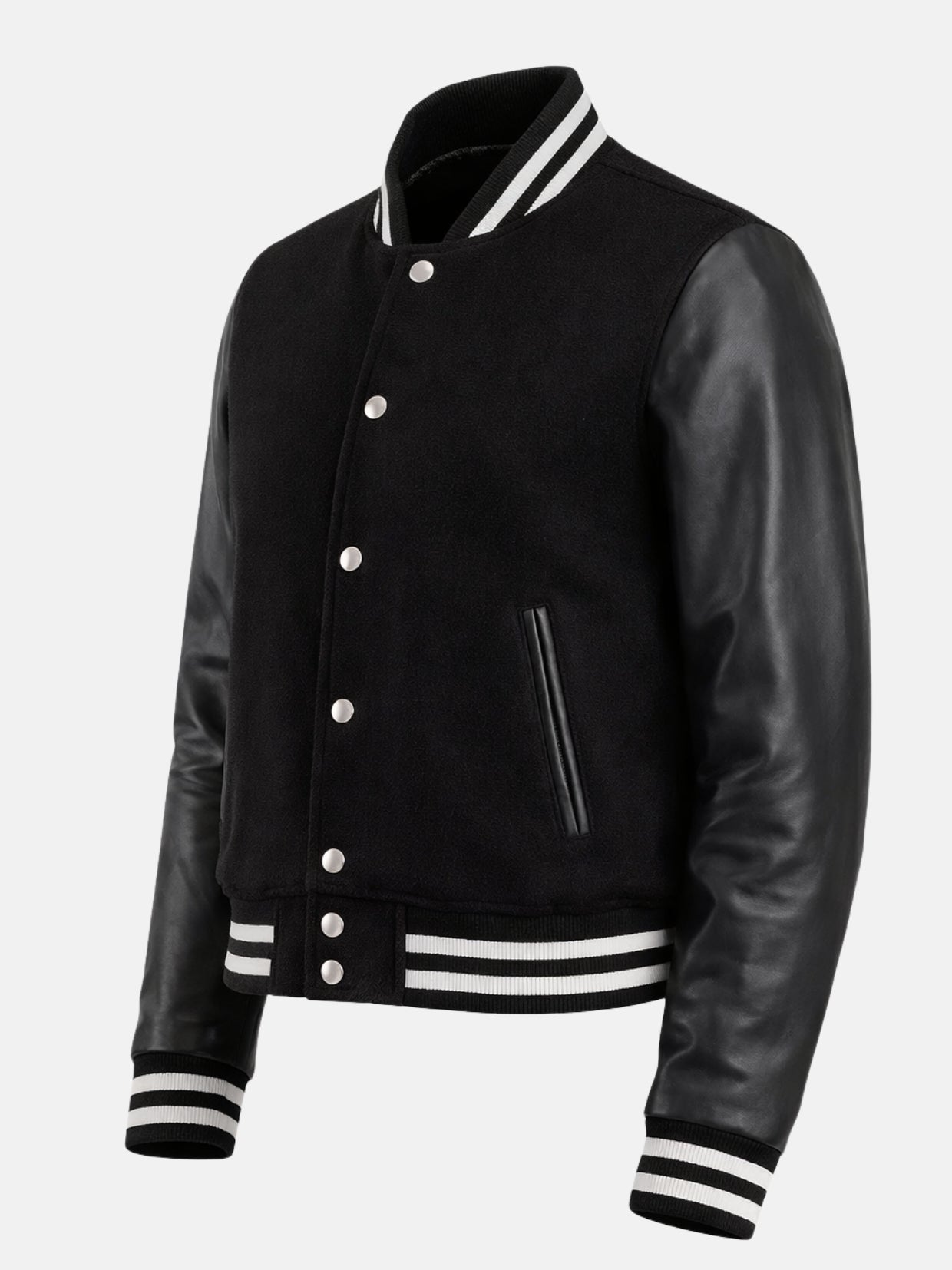 Angled view of all black womens varsity jacket with striped ribbing and hem snaps