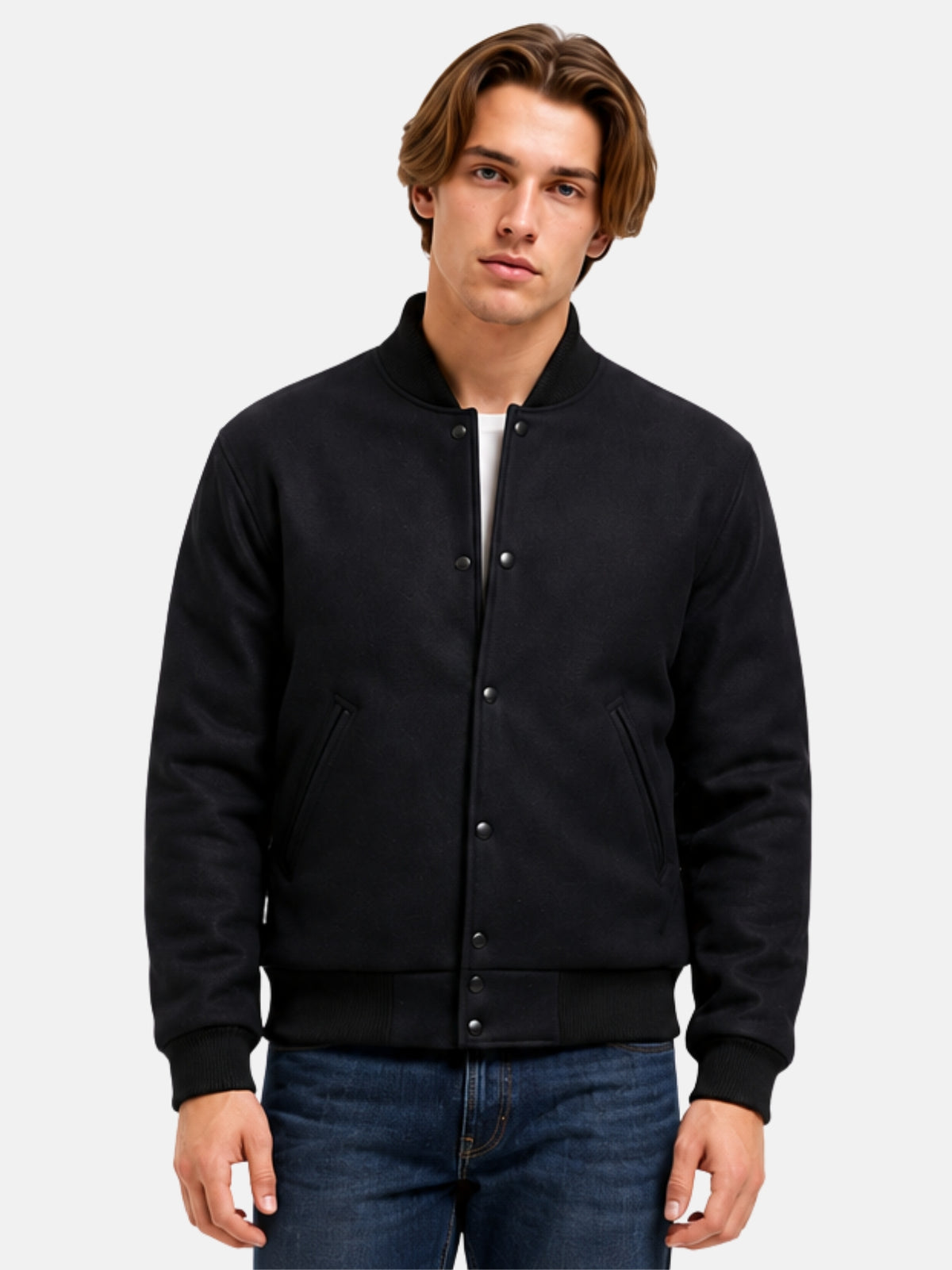 Man wearing an all black wool varsity jacket with matte snaps and tonal ribbing