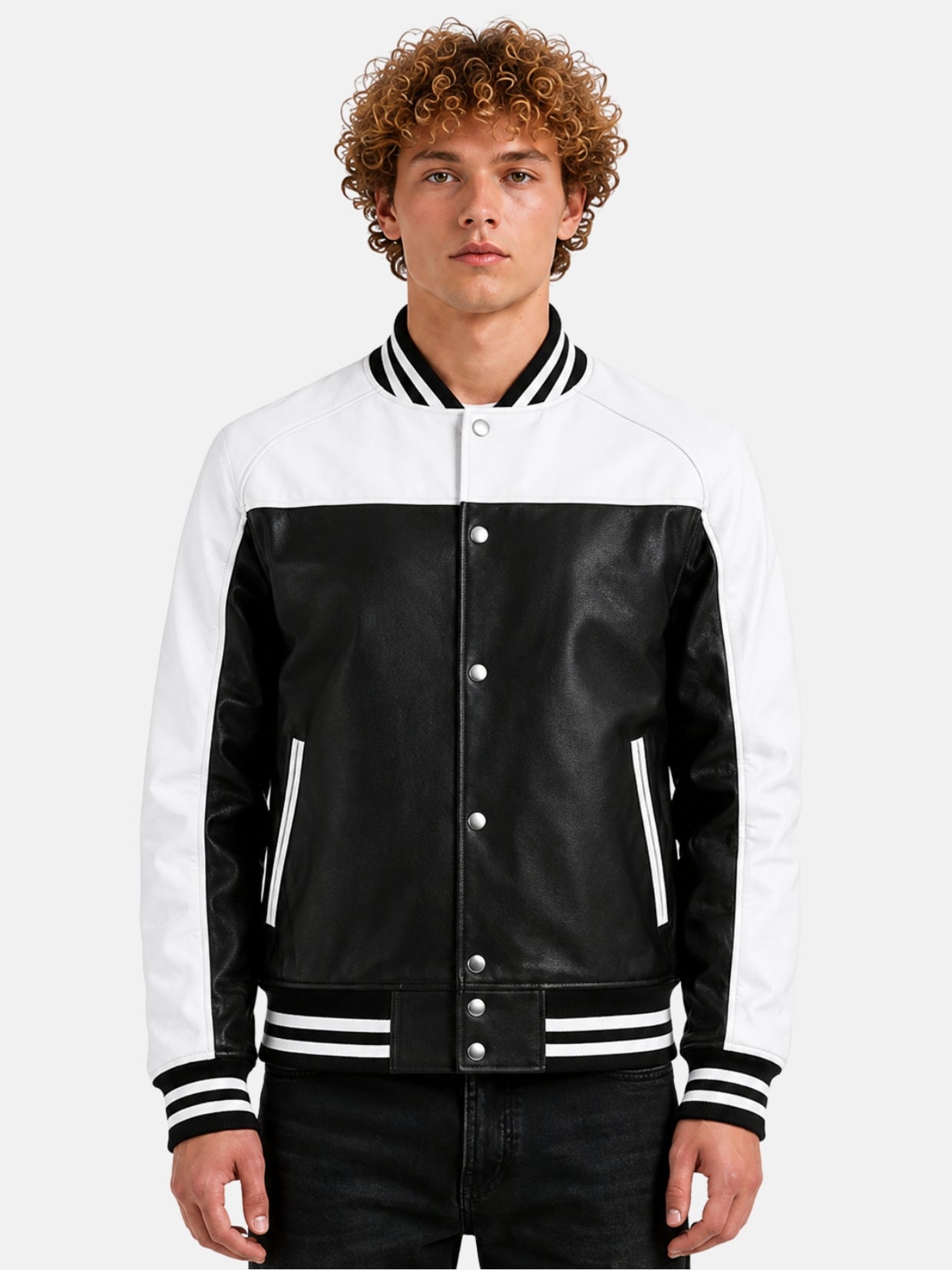 Man wearing black and white leather varsity jacket with snap front