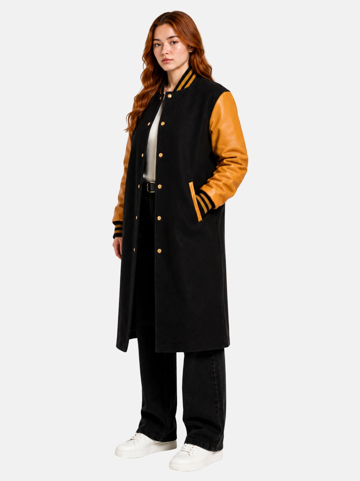 Women's black and gold bomber varsity coat, three-quarter front angle