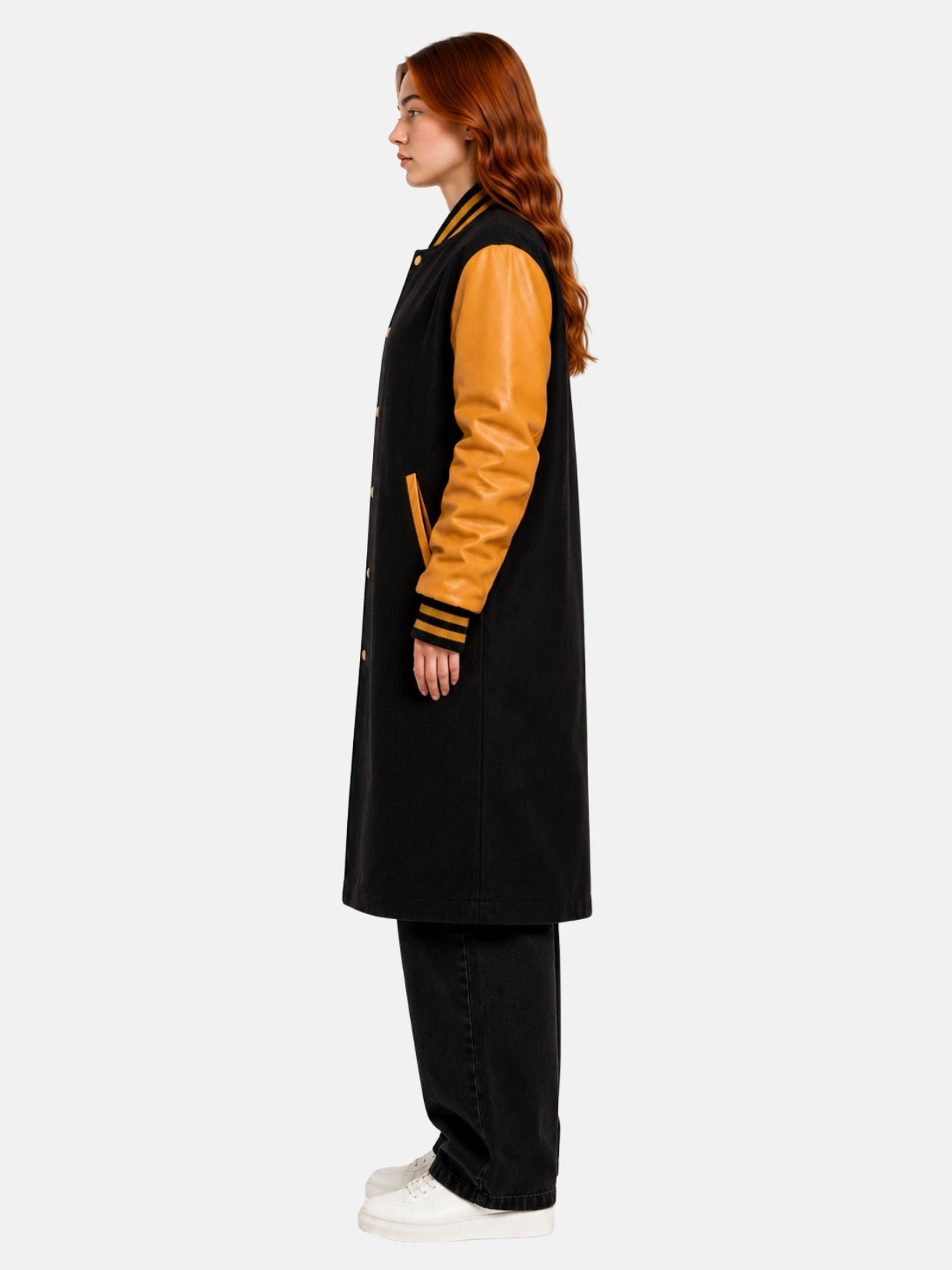 Women's black and gold bomber varsity coat, side profile view