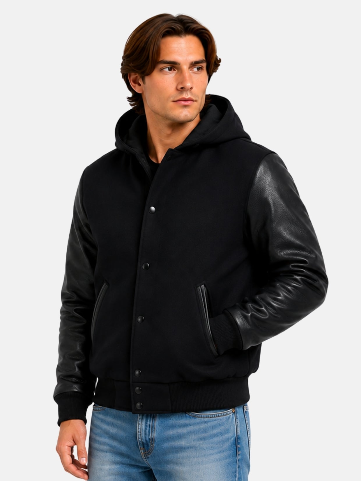 Three-quarter view of hooded black letterman jacket with hands in welt pockets