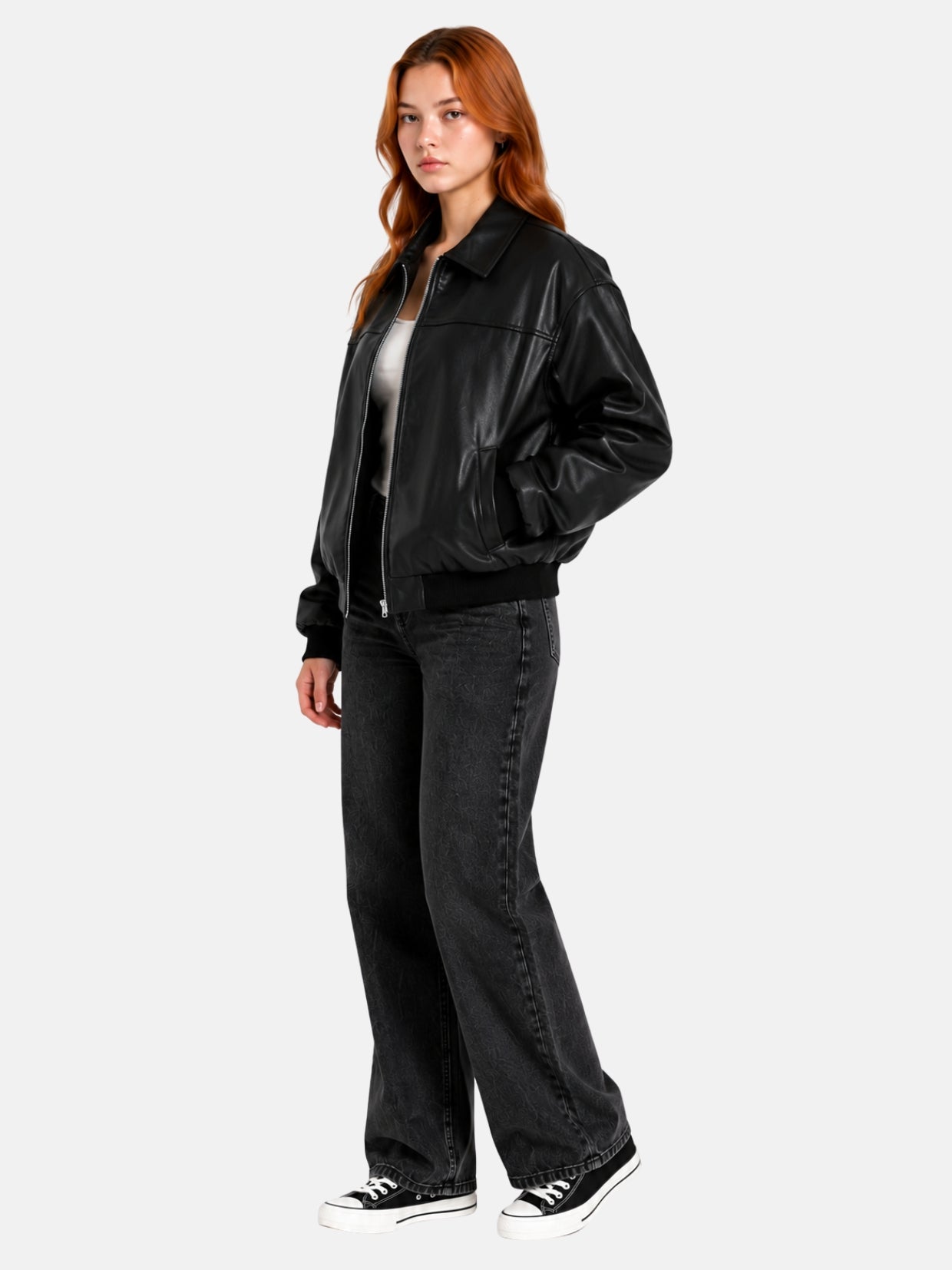 Full-length view of oversized black leather bomber jacket over black jeans