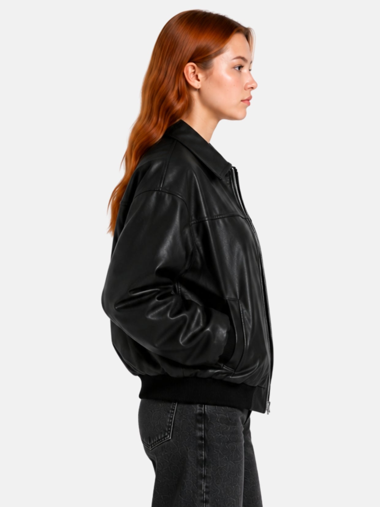 Side profile of black leather bomber jacket showing ribbed cuff and welt pocket