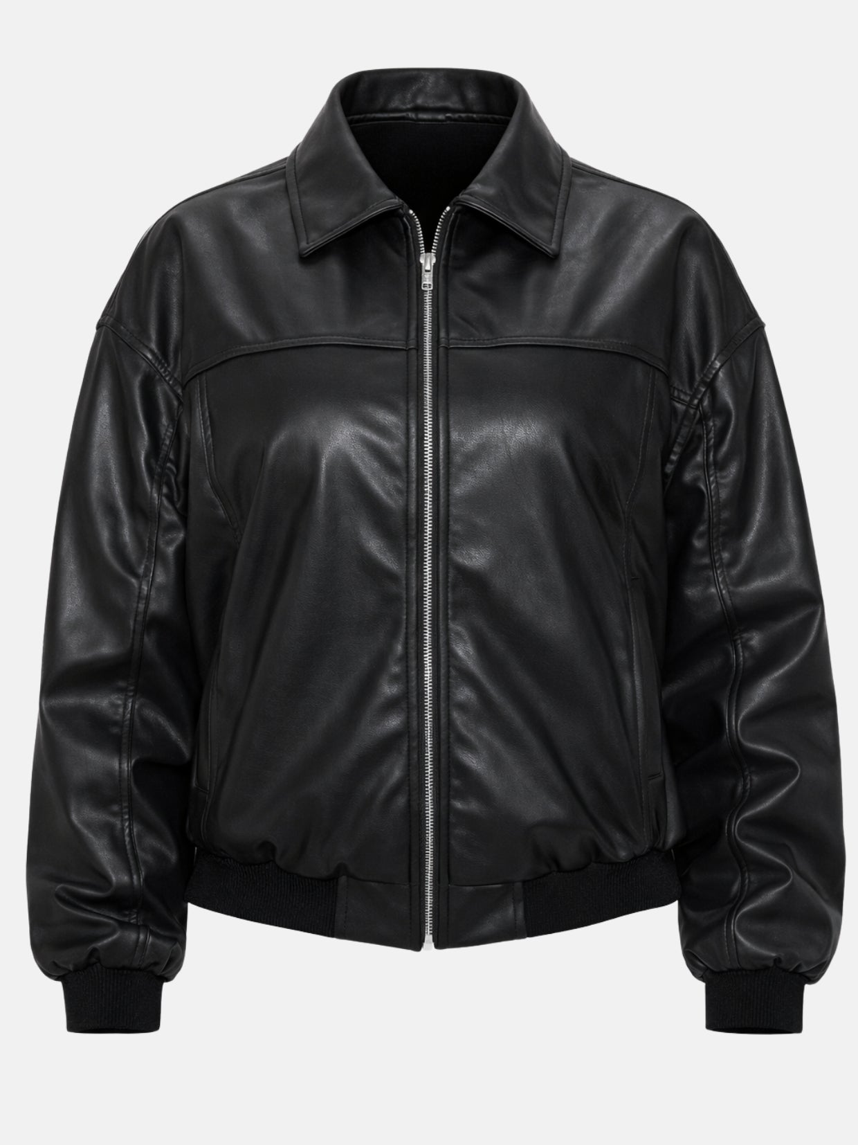 Flat lay of black leather bomber jacket with front yoke seam and ribbed hem
