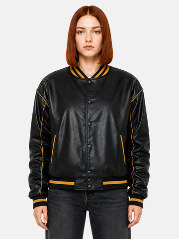 Black leather varsity jacket with gold piping and snap-button front on model