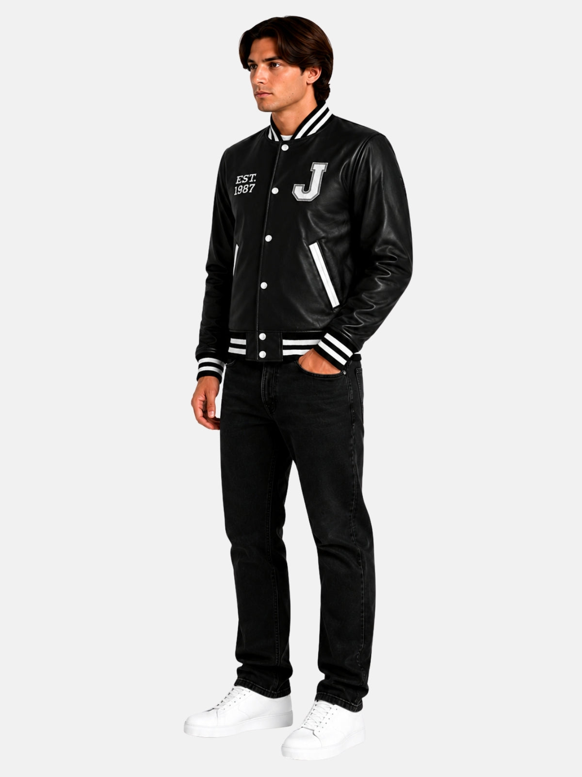 Full look with all black leather letterman jacket, black jeans and white sneakers