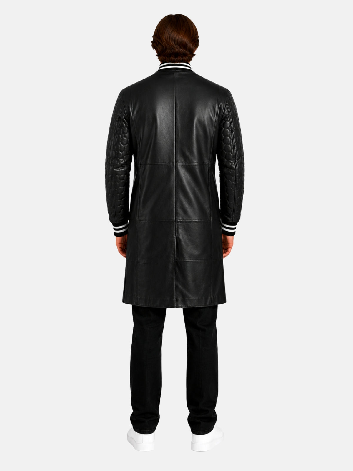 Back view of longline black leather varsity coat with panel seams on model