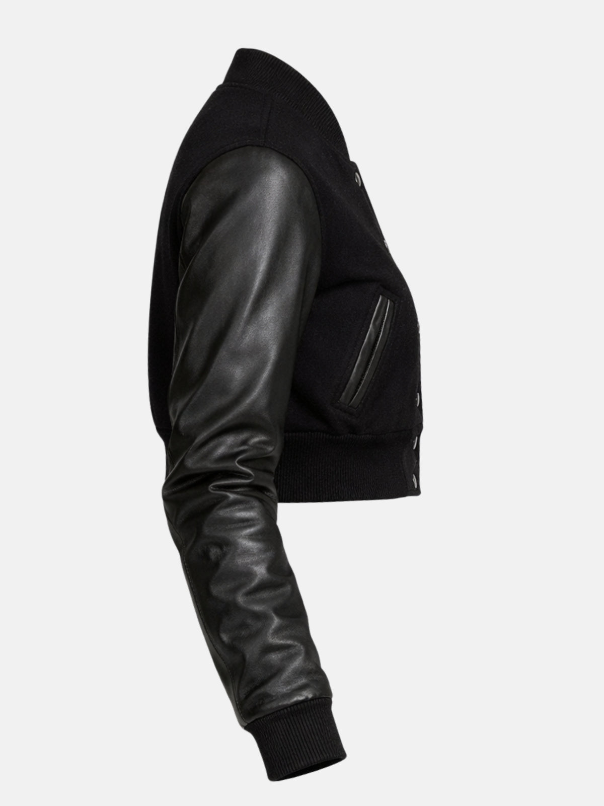 Three-quarter flat lay of black varsity jacket highlighting leather sleeve and ribbed cuff