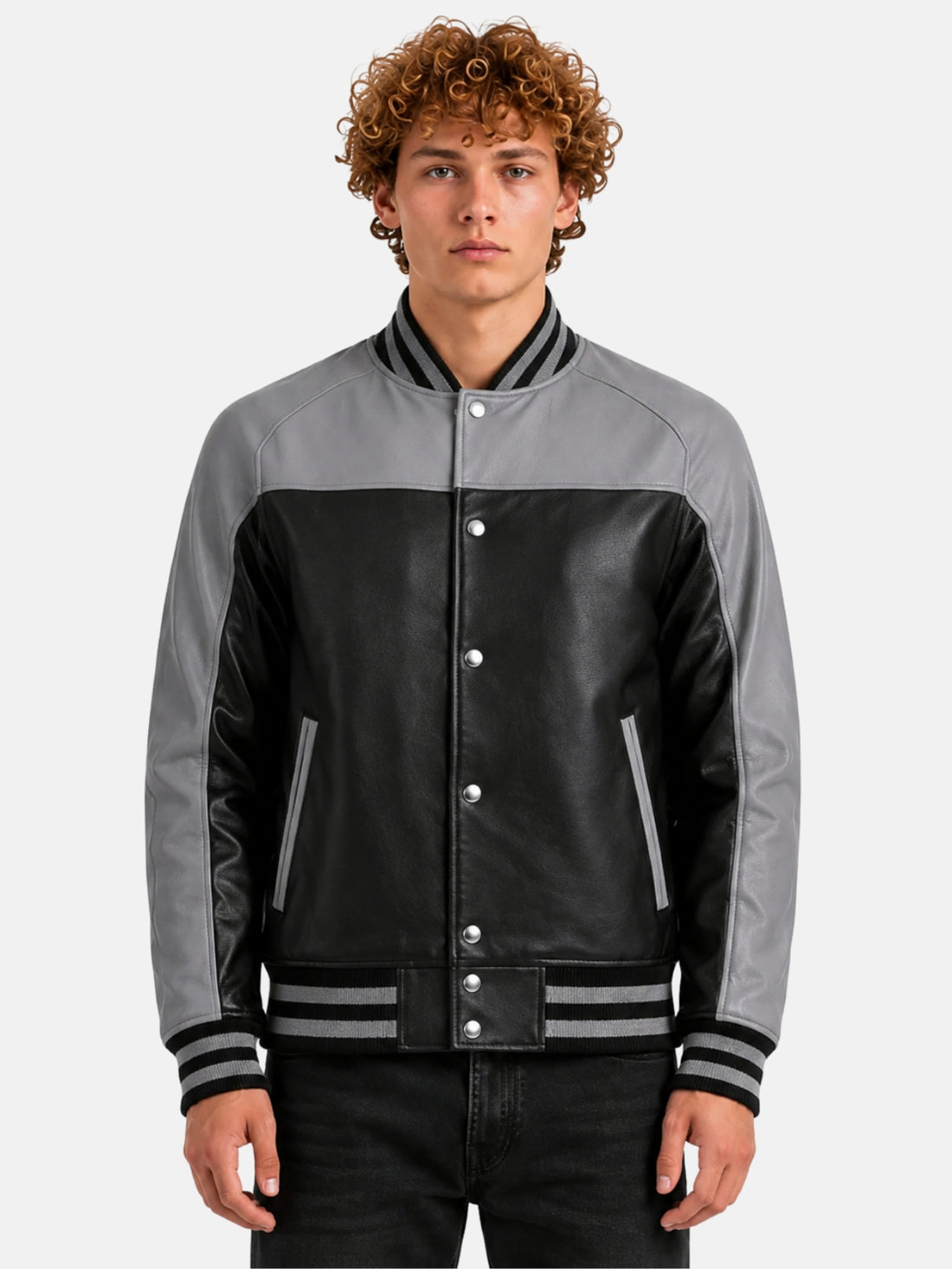 Man wearing black leather varsity jacket with grey raglan sleeves, grey yoke and striped rib trims