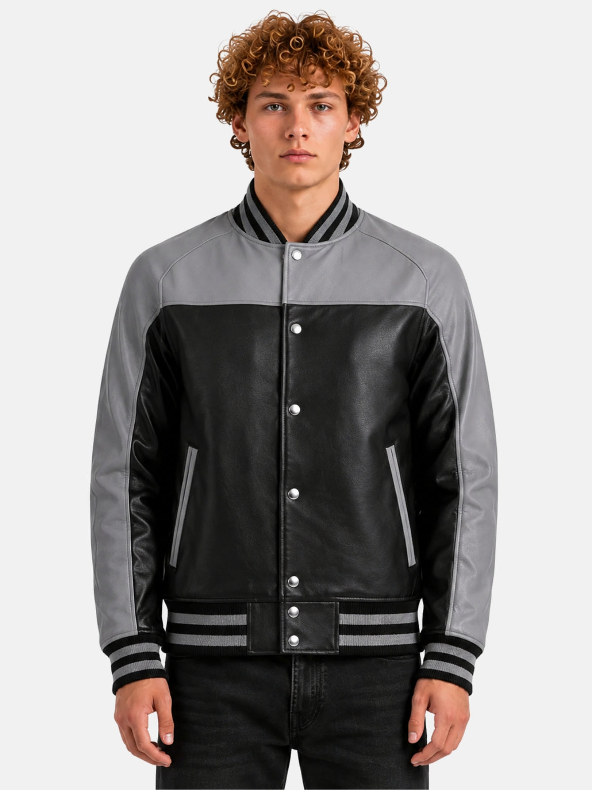 Man wearing black leather varsity jacket with grey raglan sleeves, grey yoke and striped rib trims