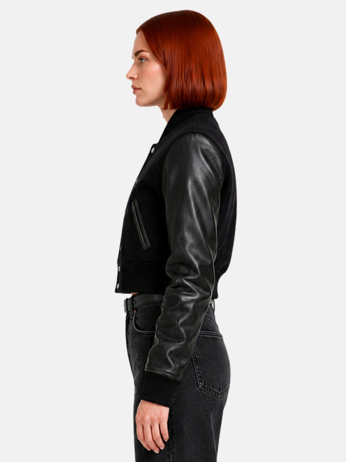 Side profile of black varsity jacket showing set-in leather sleeve and besom pocket piping