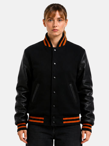Black wool varsity jacket with leather sleeves and orange ribbed trim