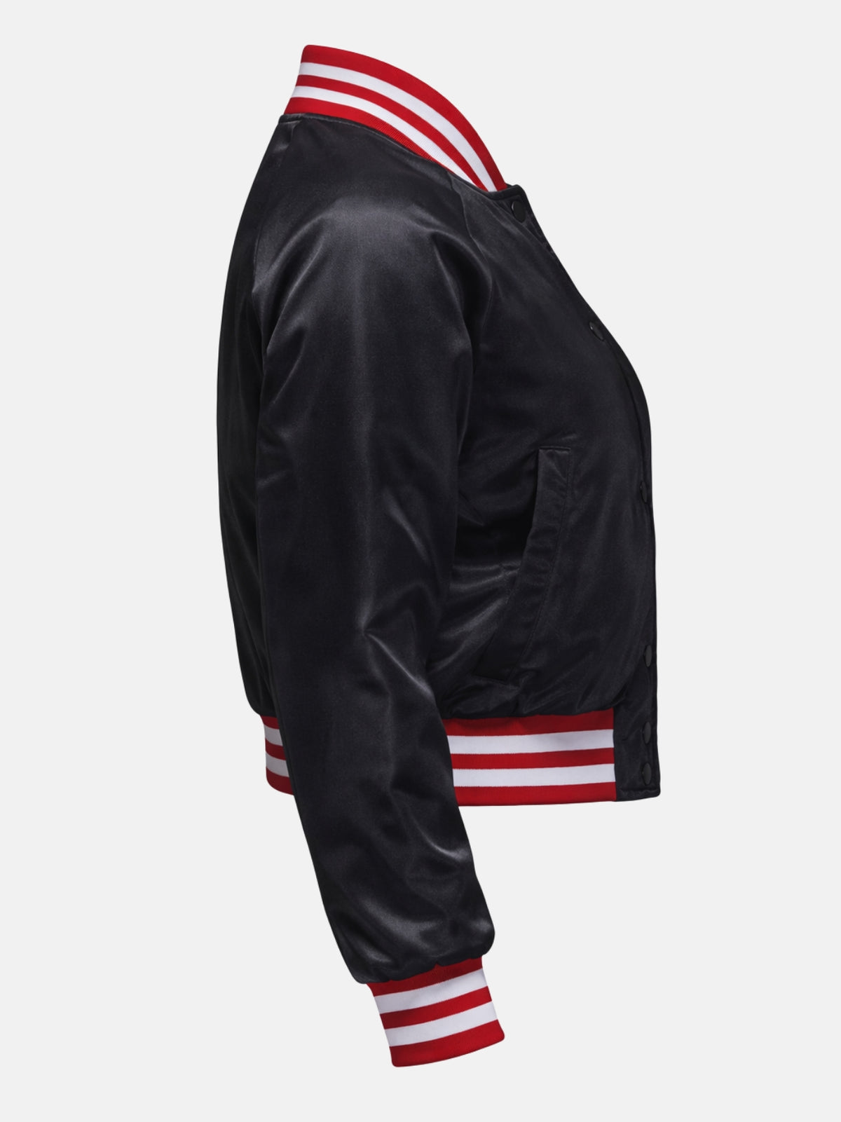 Flat lay side view of black satin jacket with red ribbed cuff detail