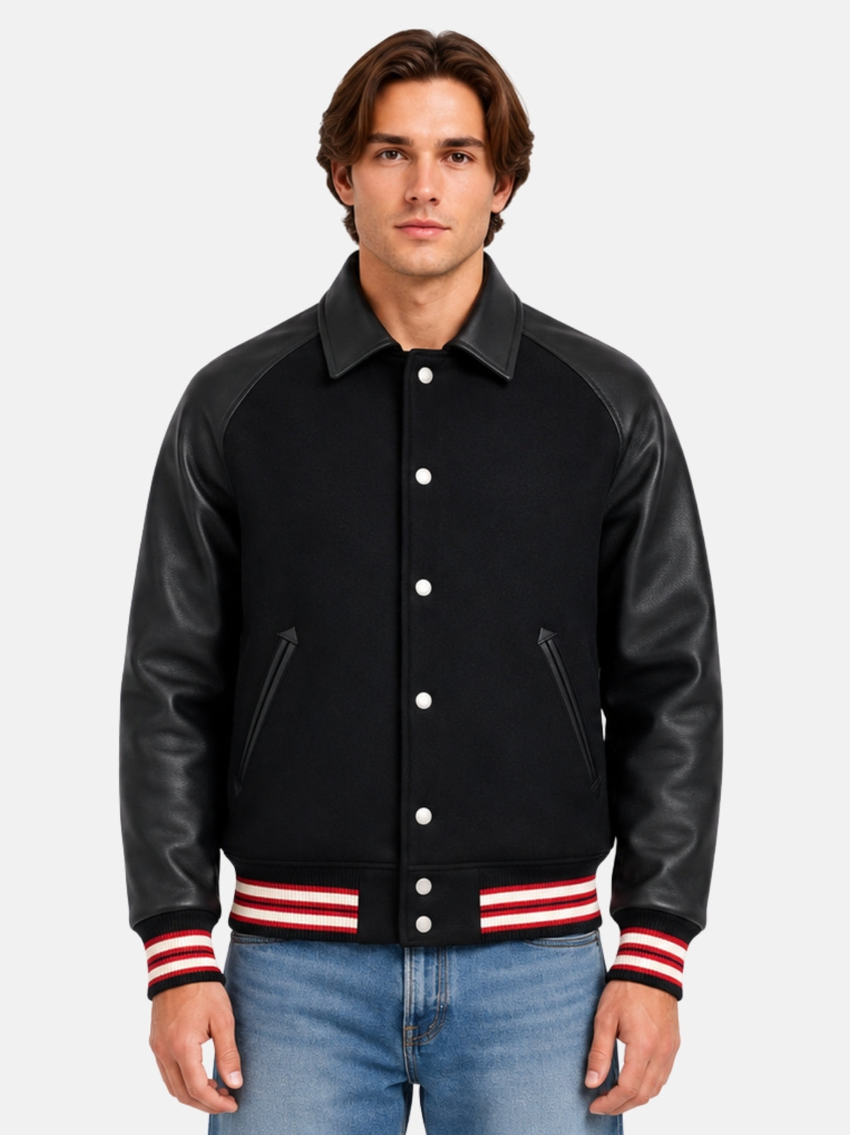 Man wearing collared black varsity jacket with leather raglan sleeves and red striped trims