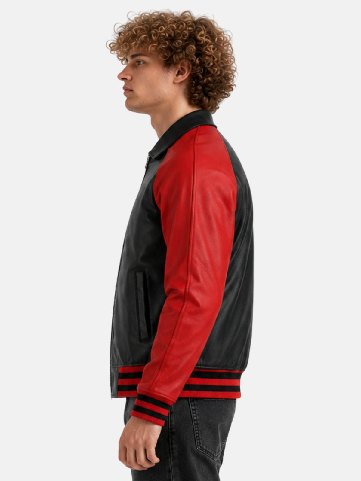 Side profile of black leather varsity jacket with red sleeve and striped hem