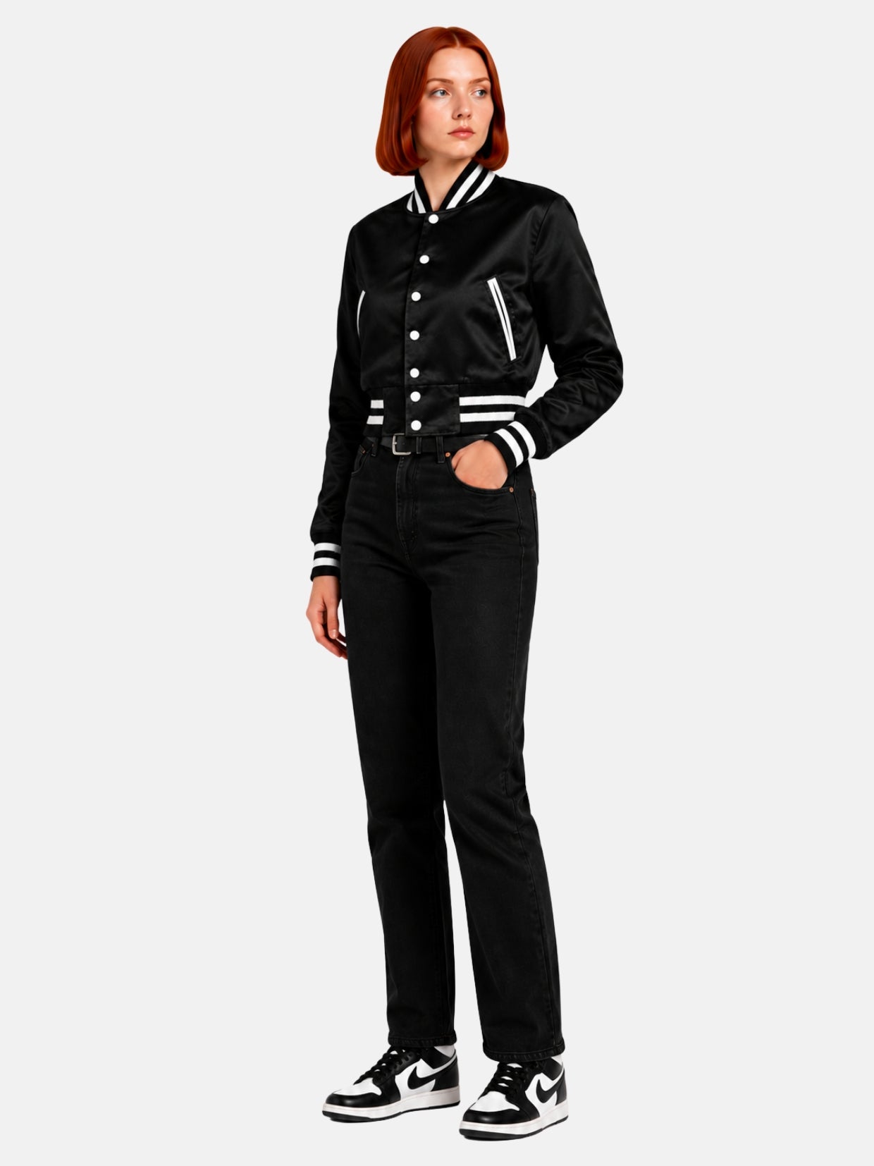 Cropped varsity jacket in black satin, three-quarter angle showing ribbed waistband