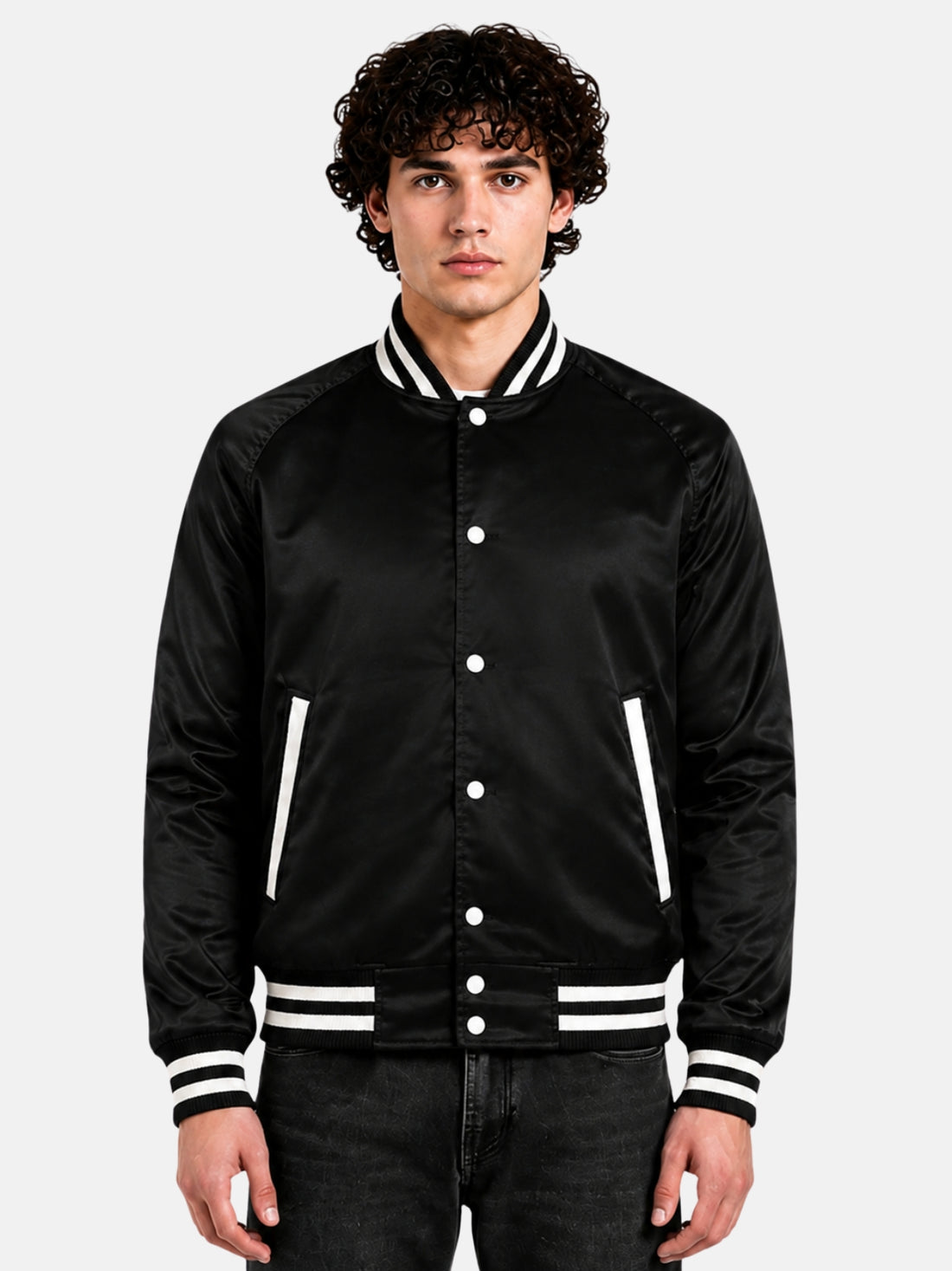 Man wearing a black satin varsity jacket with raglan sleeves and cream striped trims