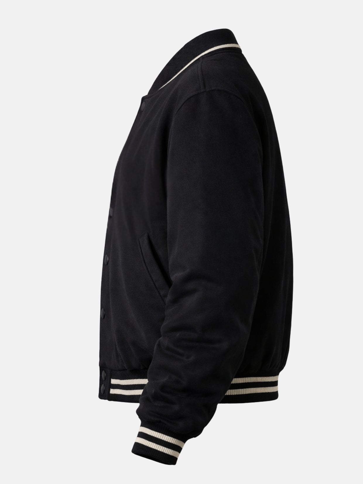 Flat lay side view of black suede jacket with cream ribbed waistband