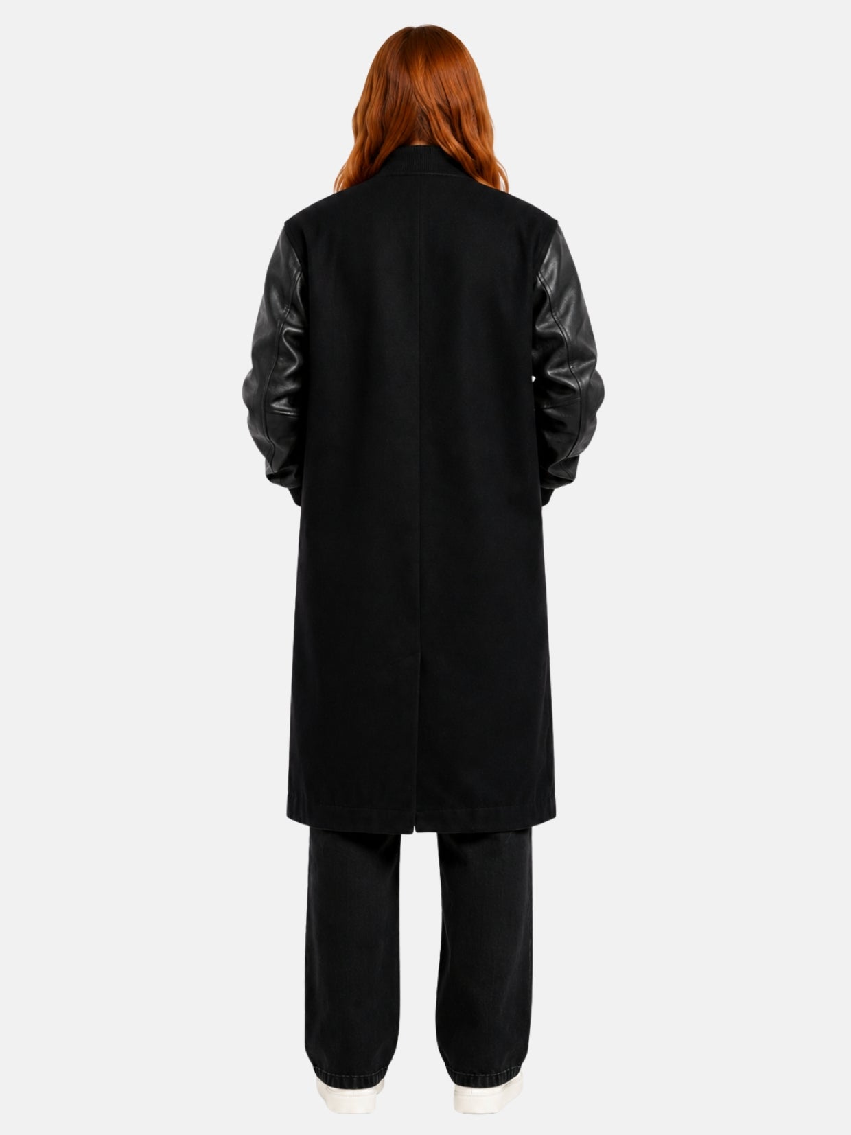 Back view of black longline varsity coat with clean back panel and vent