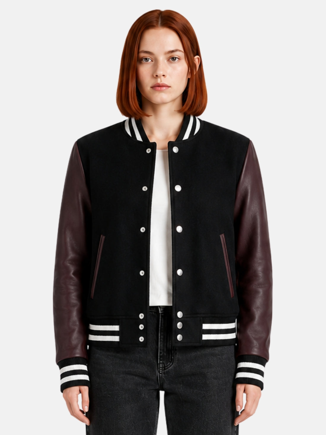 Woman wearing a black varsity jacket with burgundy leather sleeves and striped trims