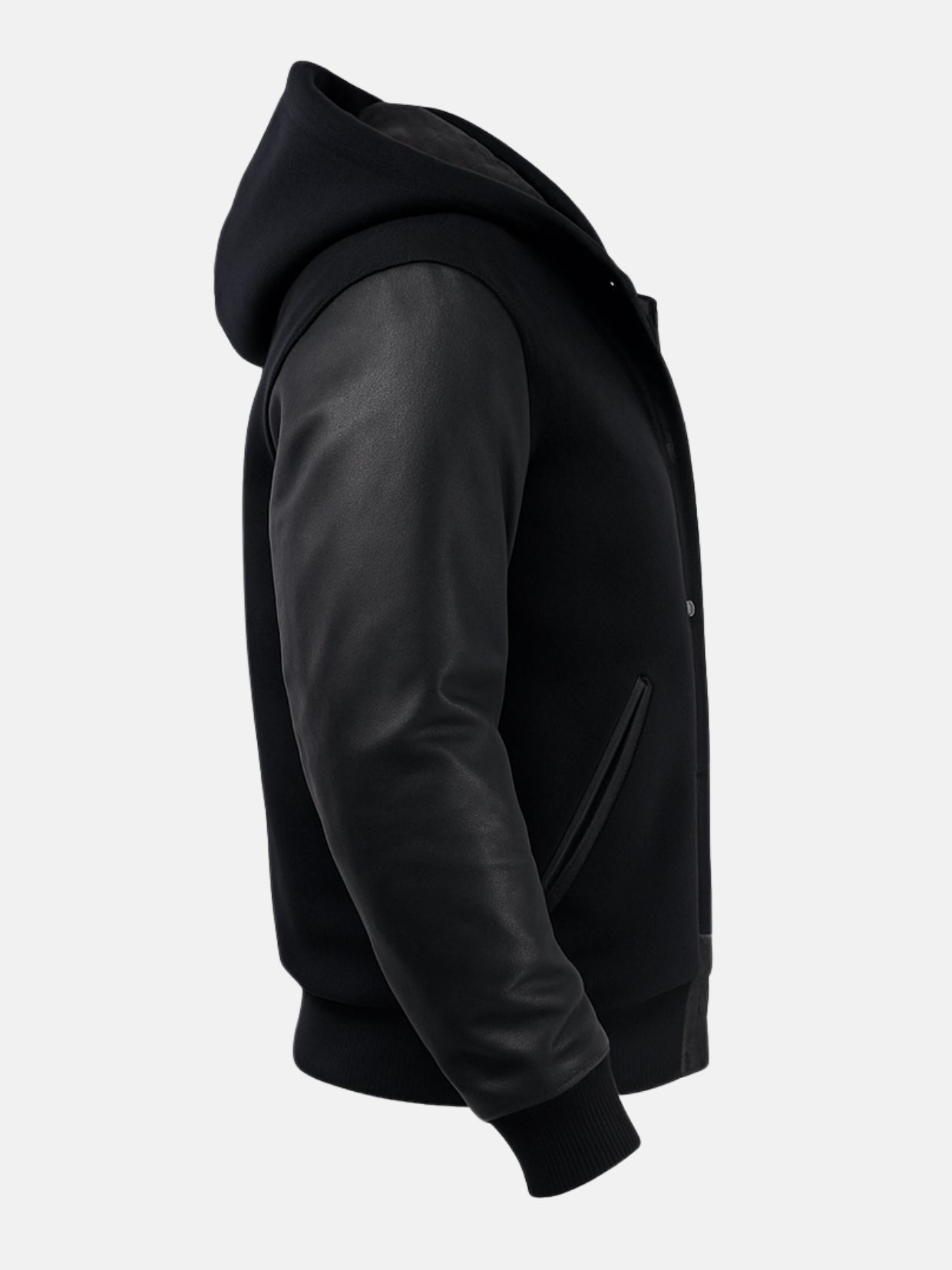 Profile of attached wool hood and leather-trimmed welt pocket on black varsity jacket