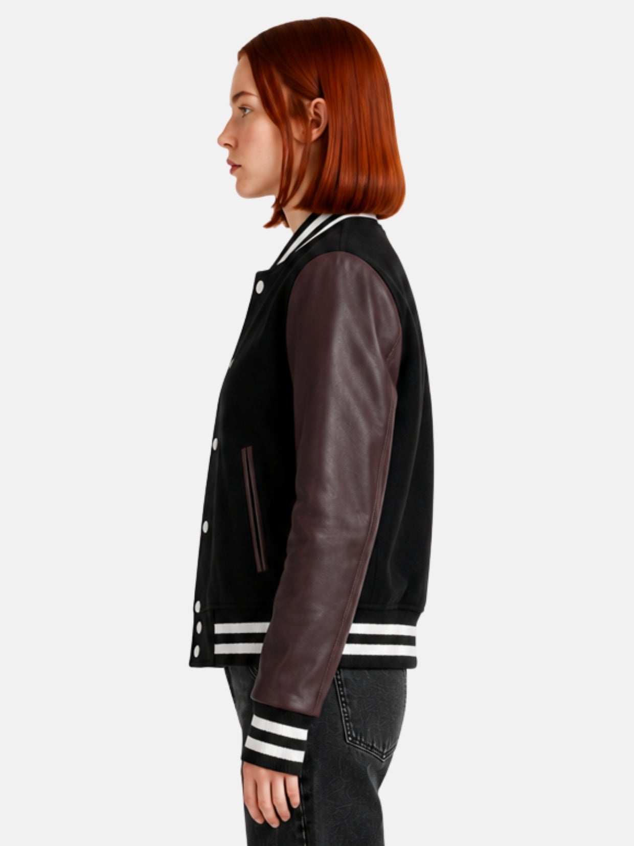 Side profile of black varsity jacket showing oxblood leather sleeve and striped cuff