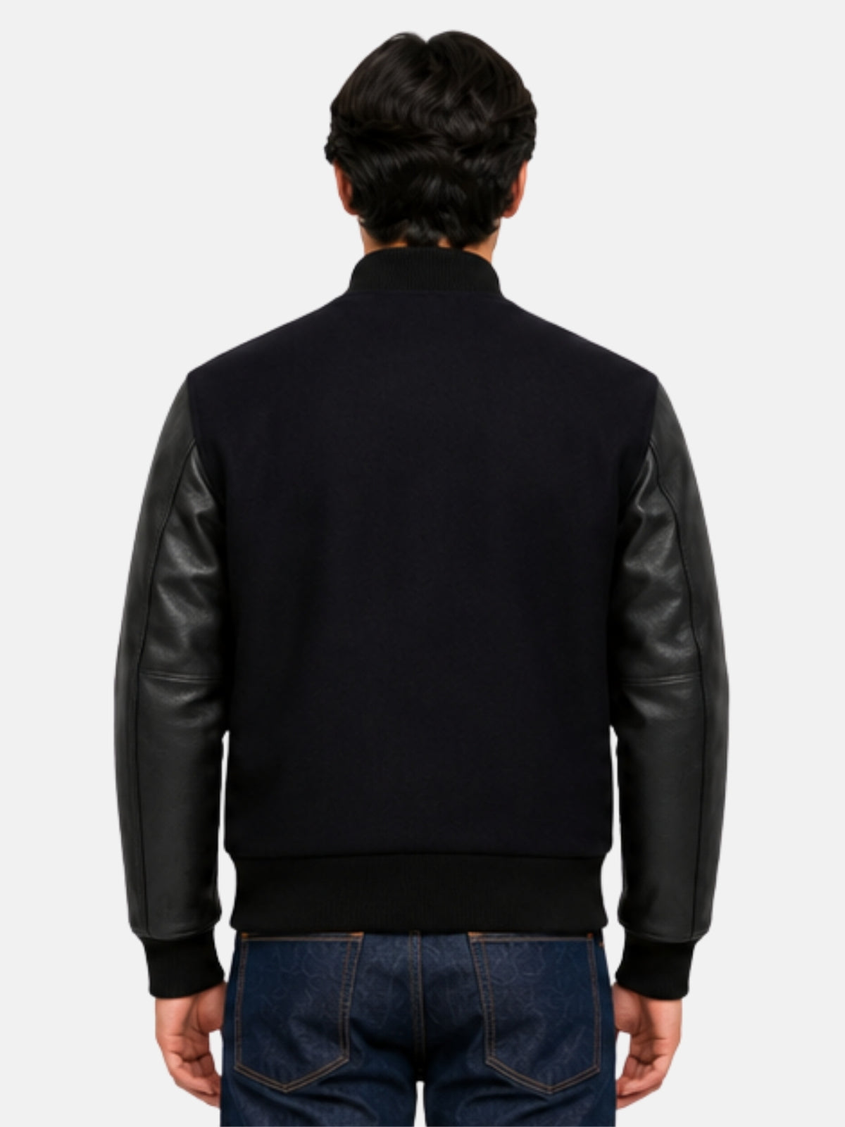 Model showing clean unbranded back of black varsity jacket with tonal leather sleeves