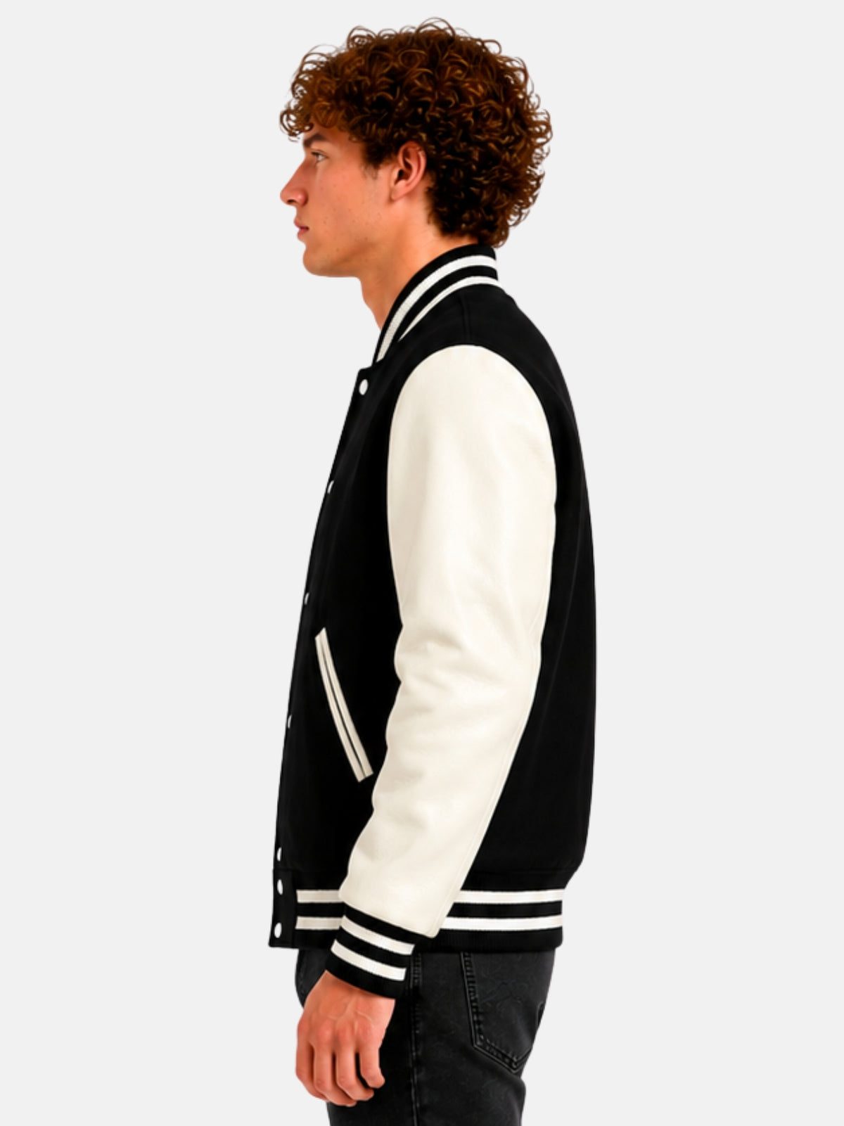 Side profile of black varsity jacket showing ivory sleeve and striped cuff