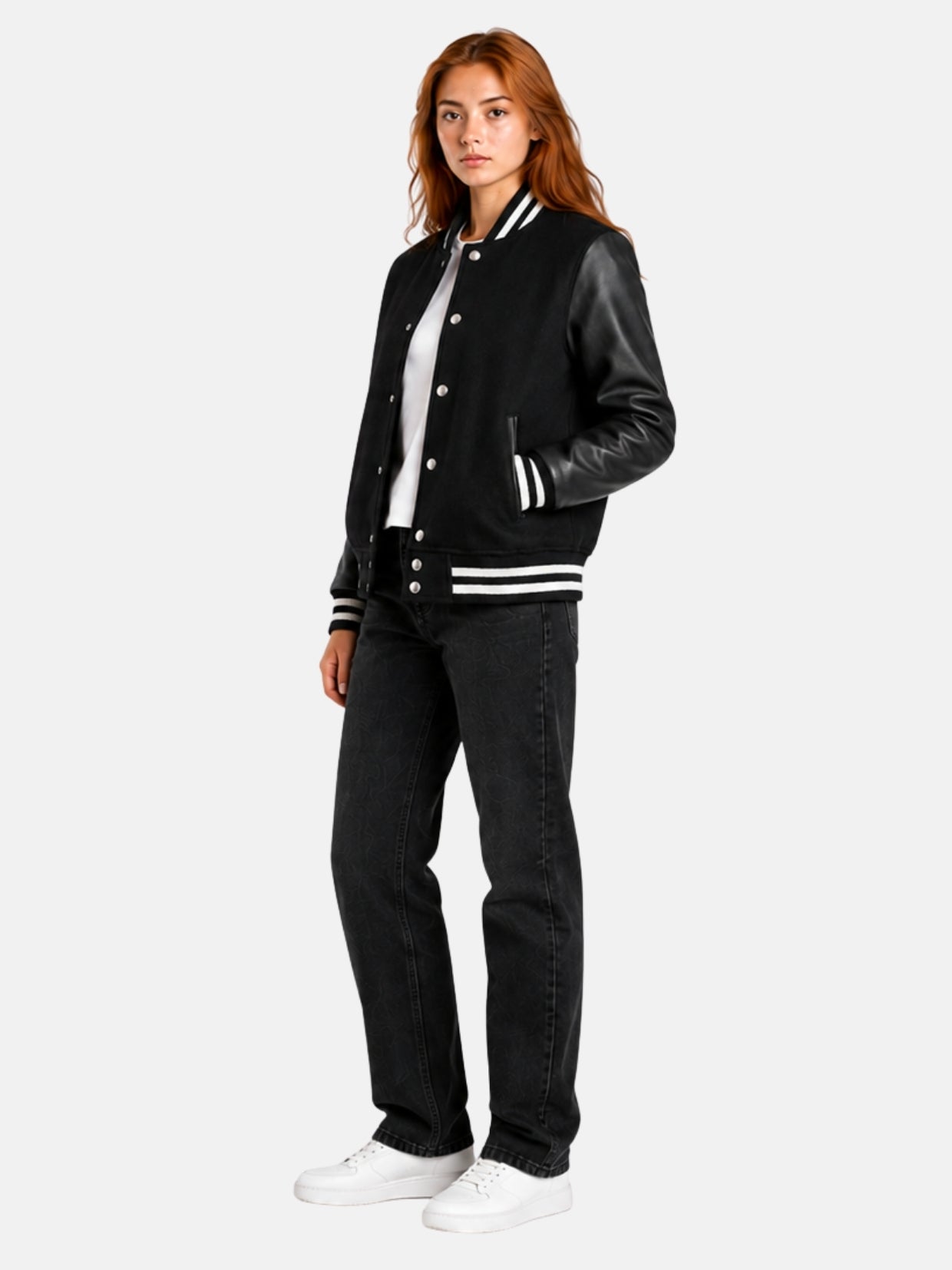 Full-length view of female model in black varsity jacket with black jeans