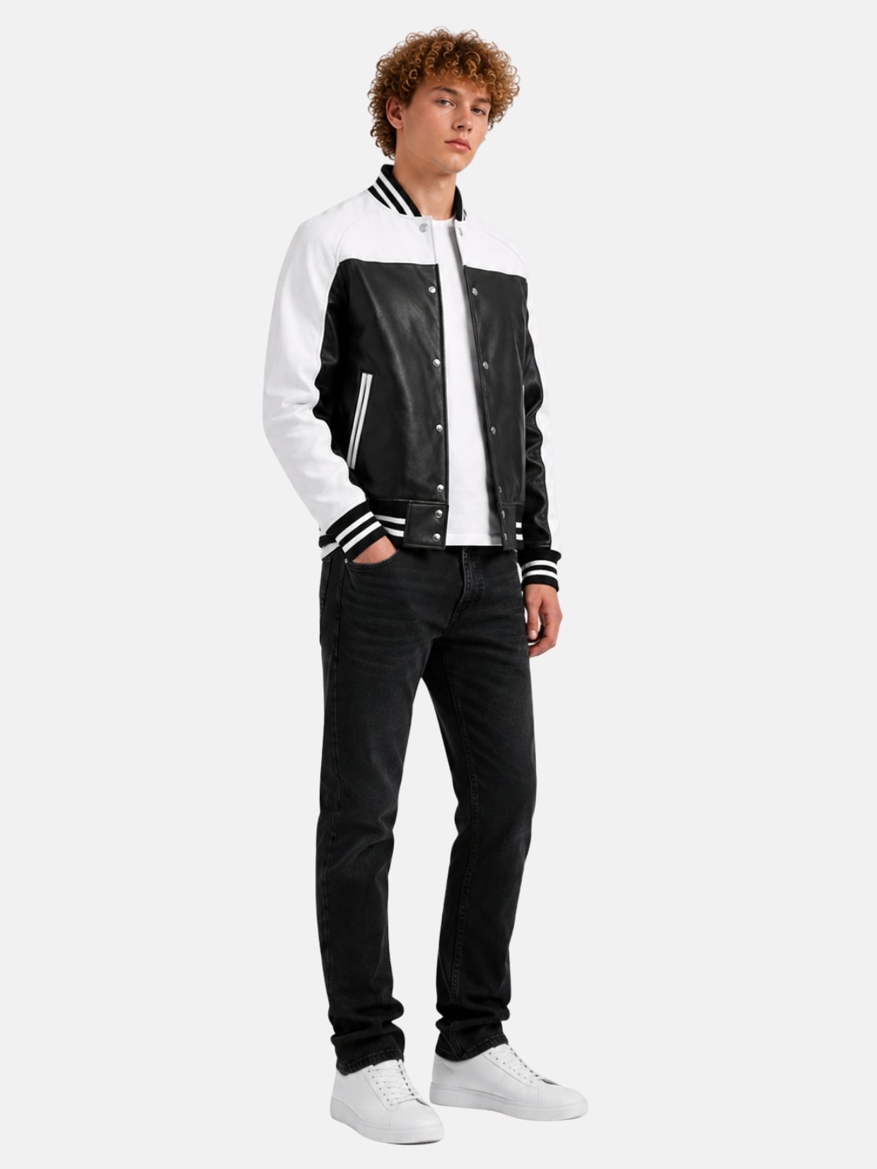 Full-length look with black and white leather varsity jacket and black jeans