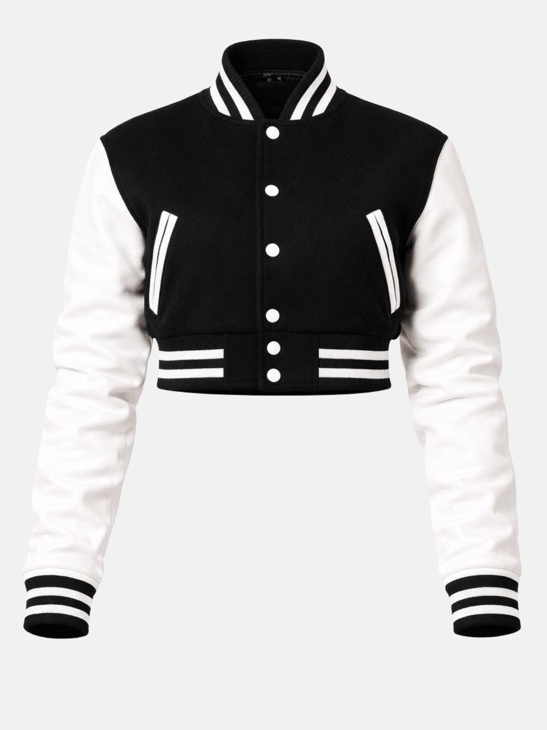 Model in black wool varsity jacket with white leather sleeves, snapped open over a white crop top