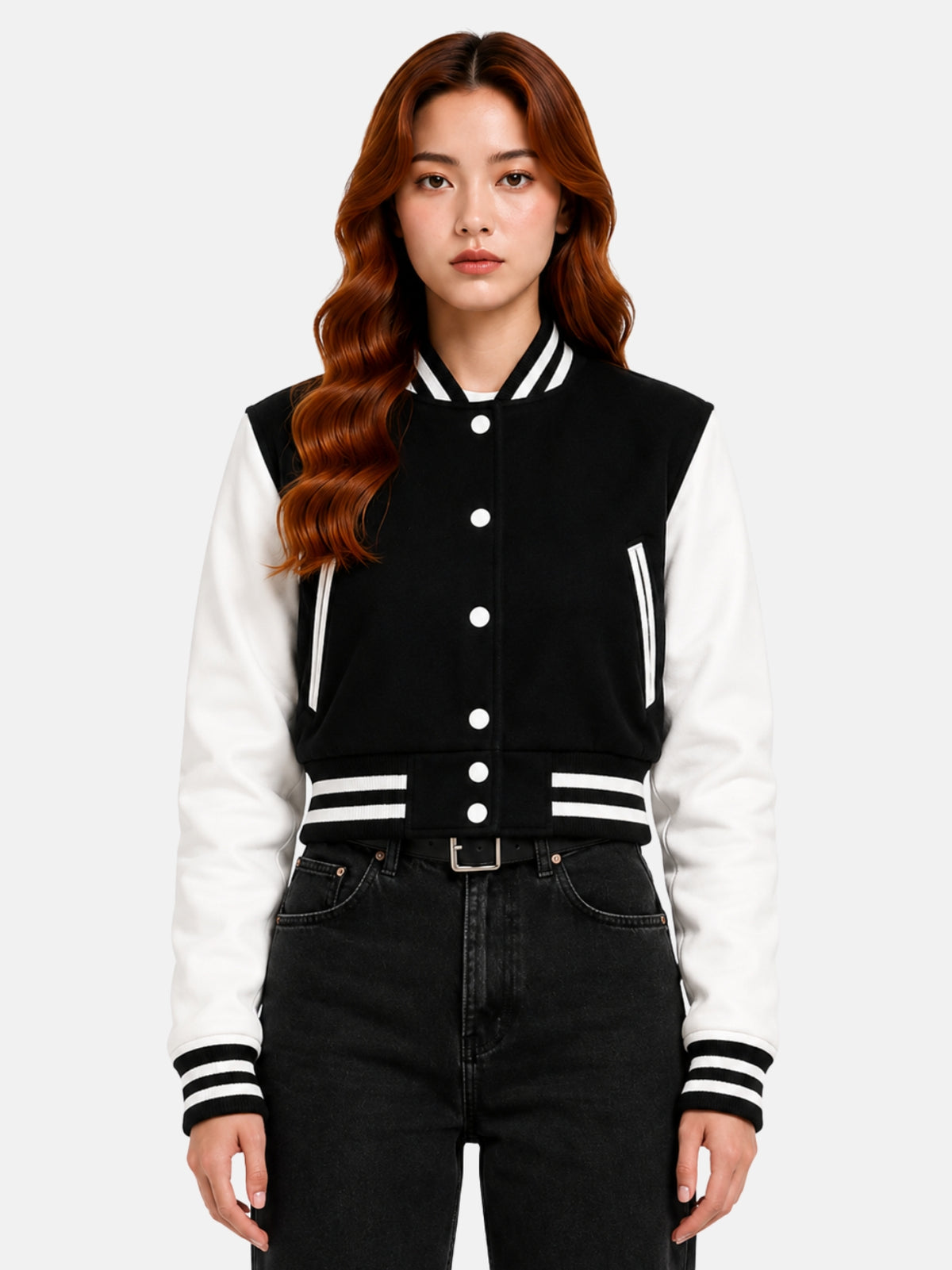 Model in black wool varsity jacket with white leather sleeves, snapped open over a white crop top
