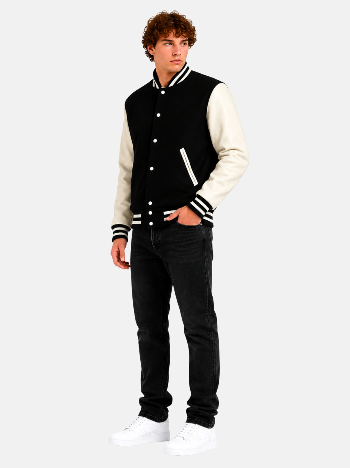 Full-length view of model in black wool varsity jacket with ivory sleeves