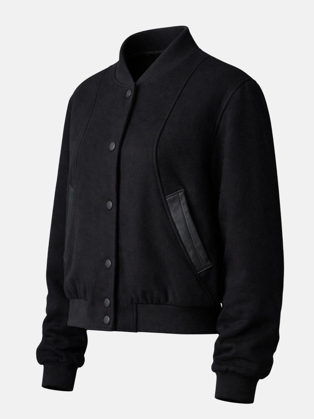 Angled flat lay of black wool jacket showing snap placket and princess seams