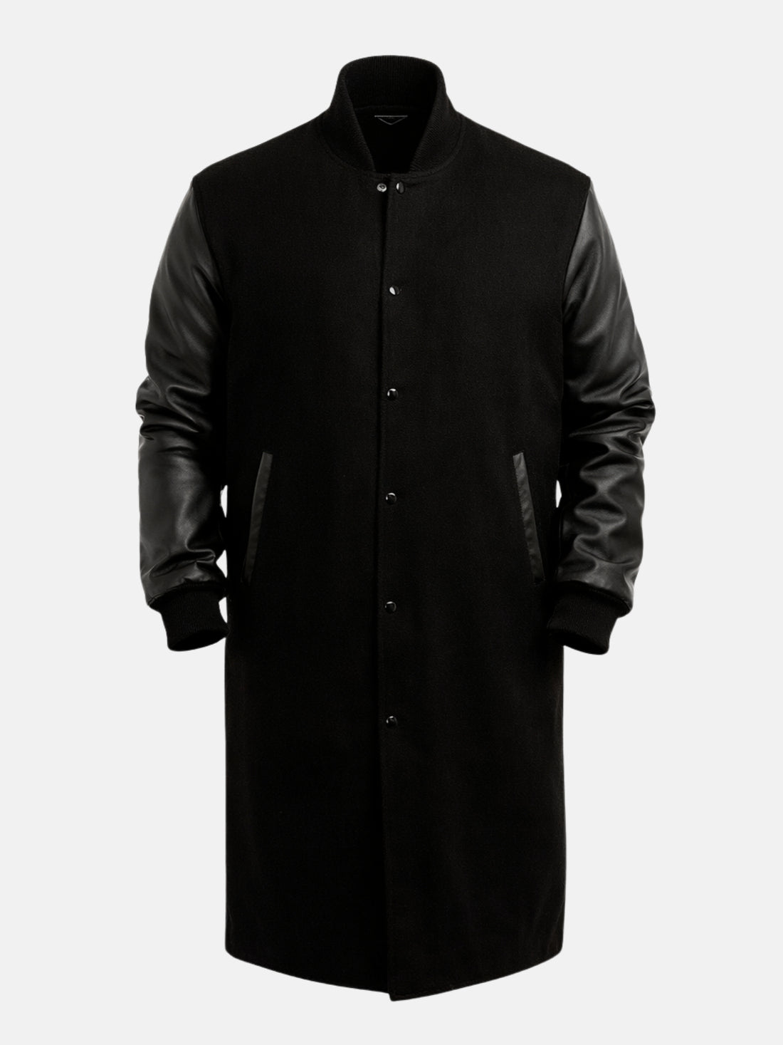 Man wearing knee-length black wool varsity coat with leather sleeves and snap front