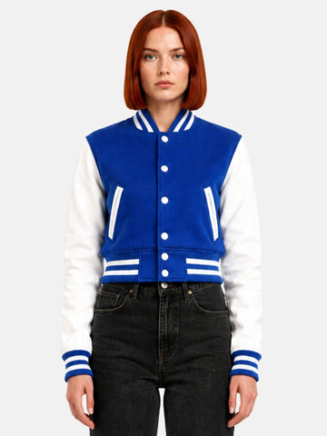 Model in royal blue wool jacket with white leather sleeves, snapped closed, front view