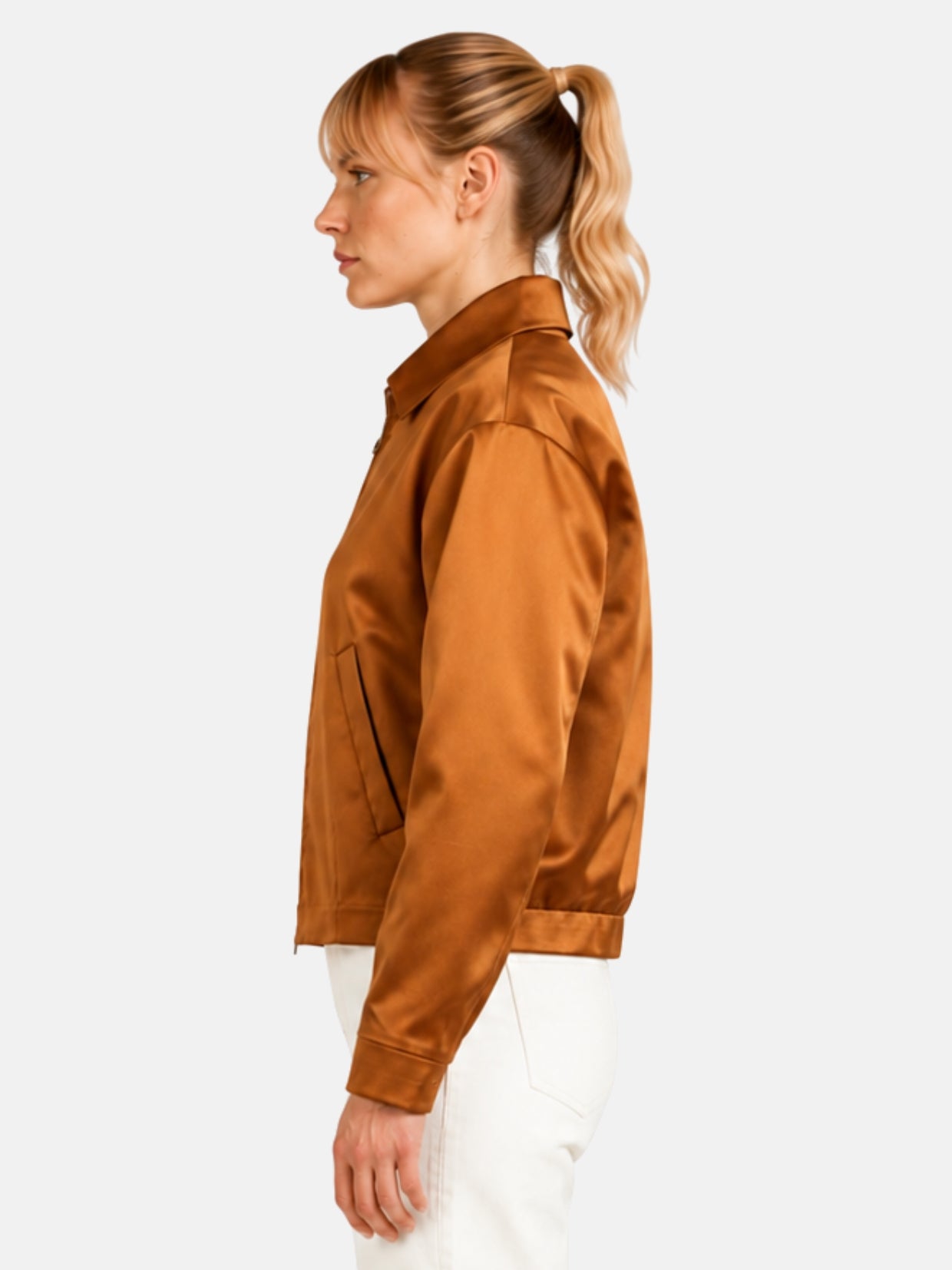 Side profile of bronze satin jacket showing angled welt pocket