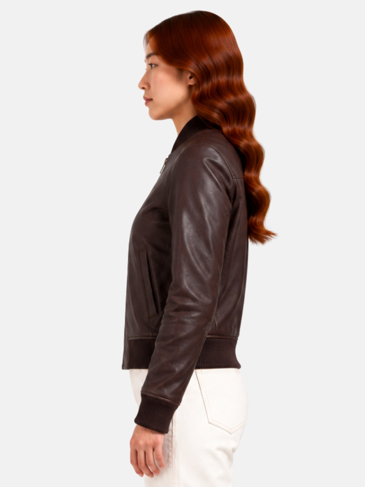 Side profile of brown leather jacket showing vertical welt pocket and set-in sleeve