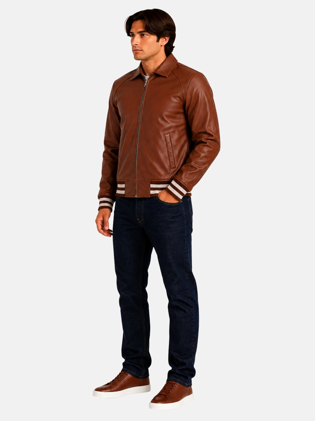 Full-length look with brown leather varsity jacket, dark denim and brown sneakers