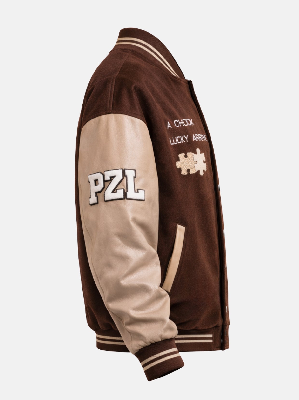 Side view of a brown letterman jacket showing PZL patch on cream leather sleeve