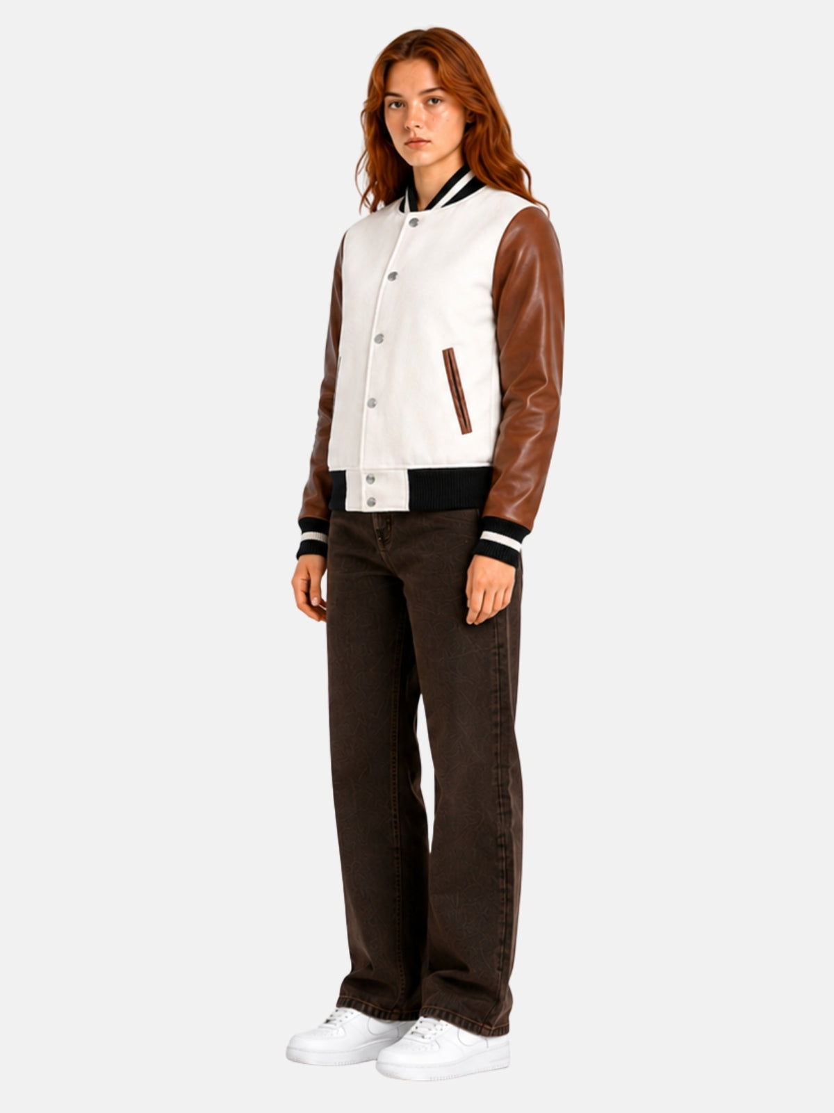 Full-length view of female model in white and brown varsity jacket with dark denim