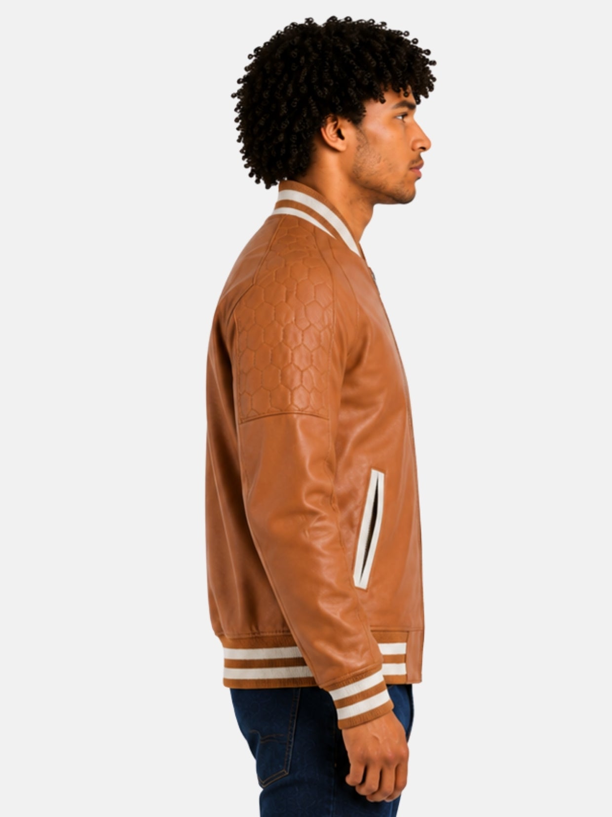 Side profile of camel leather letterman jacket with honeycomb quilted shoulder