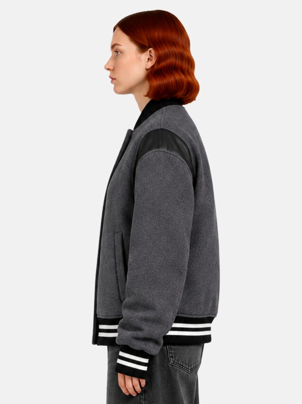 Side profile of charcoal wool jacket showing leather shoulder panel detail