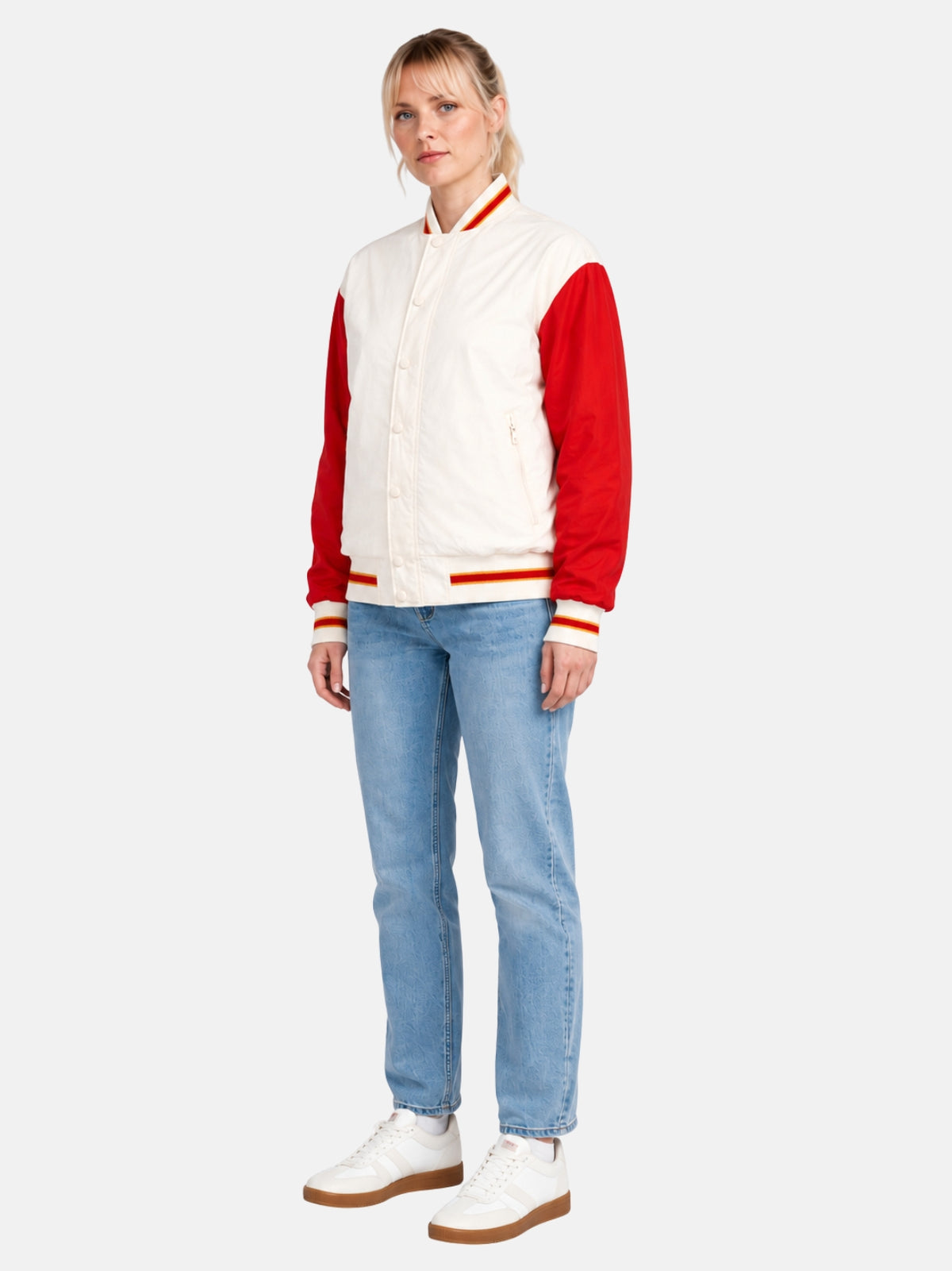 Angled full-body view of cream and red windbreaker varsity jacket