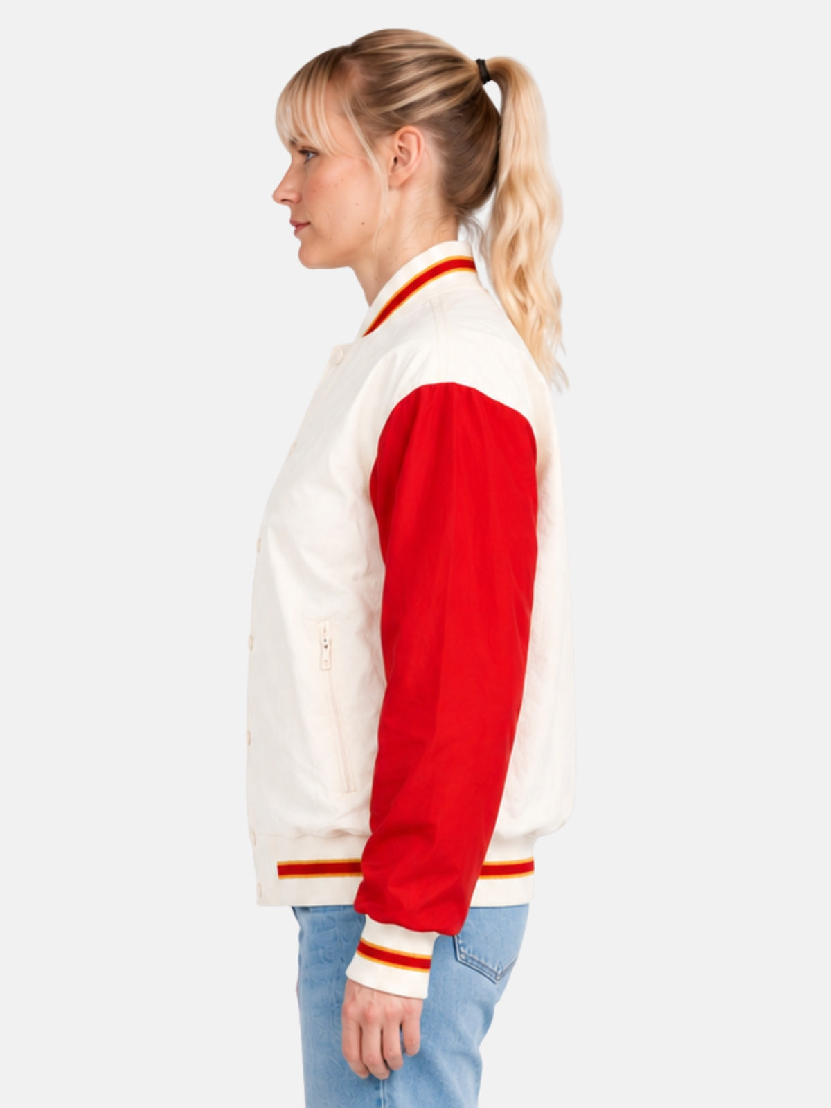 Side profile of cream windbreaker jacket showing zippered pocket