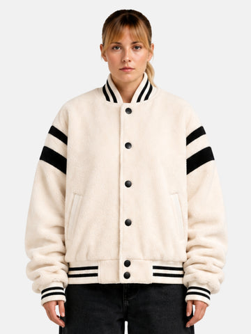 Cream sherpa fleece varsity jacket with black sleeve stripes, front view on model