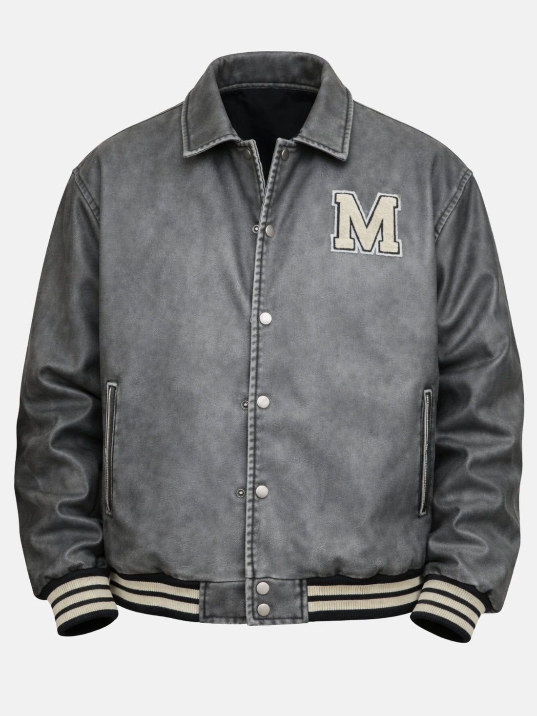Man wearing a distressed grey leather varsity jacket with chenille M patch and snap front