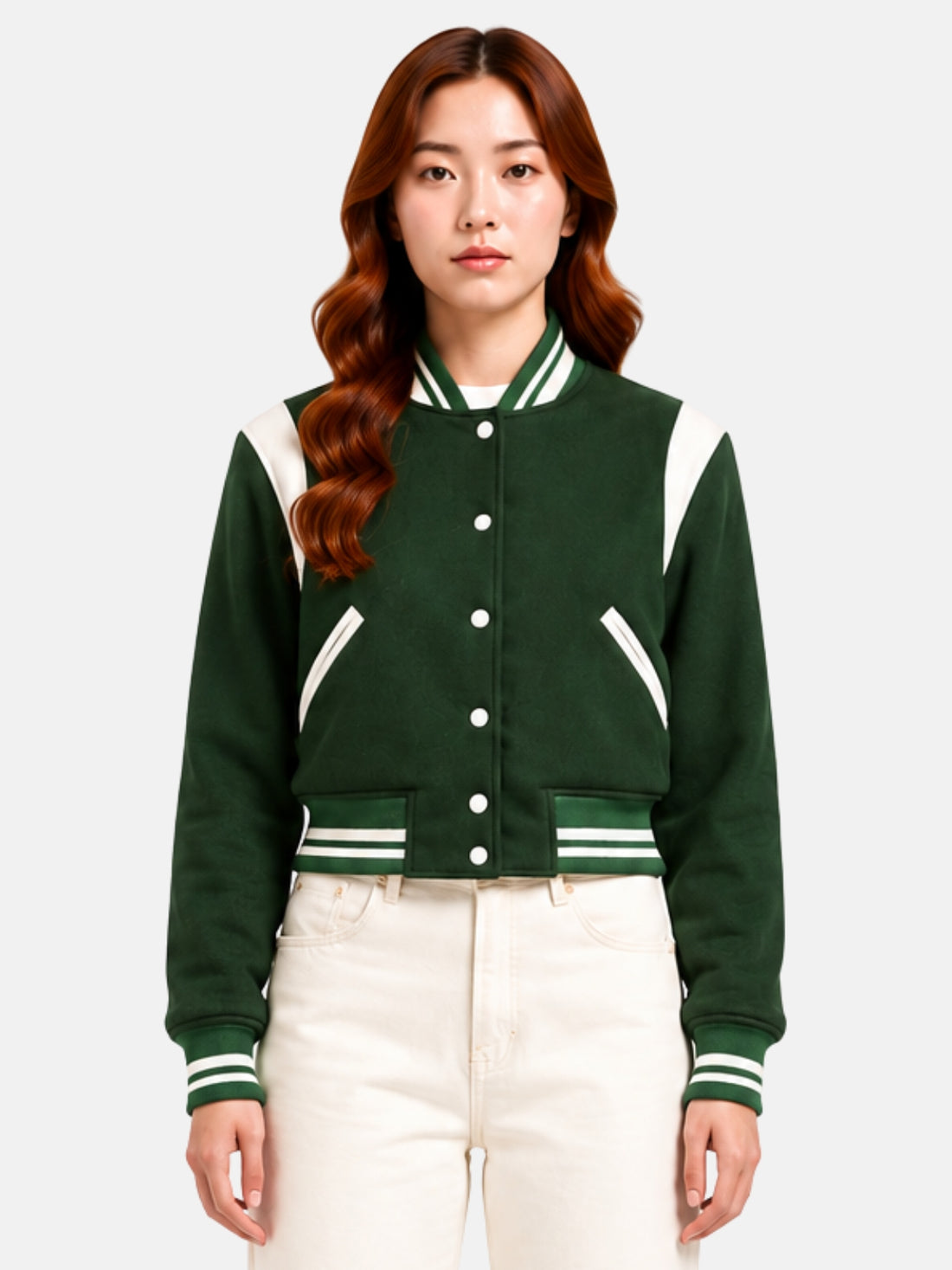 Model wearing forest green wool varsity jacket buttoned to the collar, five cream snaps down the placket, curved cream shoulder panel visible at both collarbones